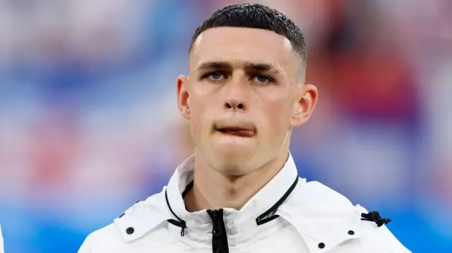 Phil Foden looks on before England's game against Serbia