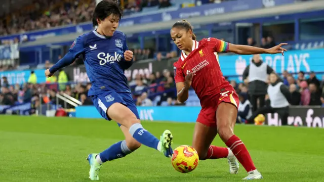 Honoka Hayashi of Everton battles for possession with Taylor Hinds of Liverpool at Goodison Park