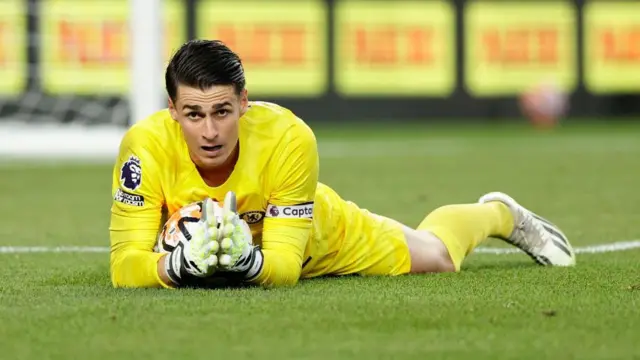 Kepa Arrizabalaga holds onto ball on grass for Chelsea