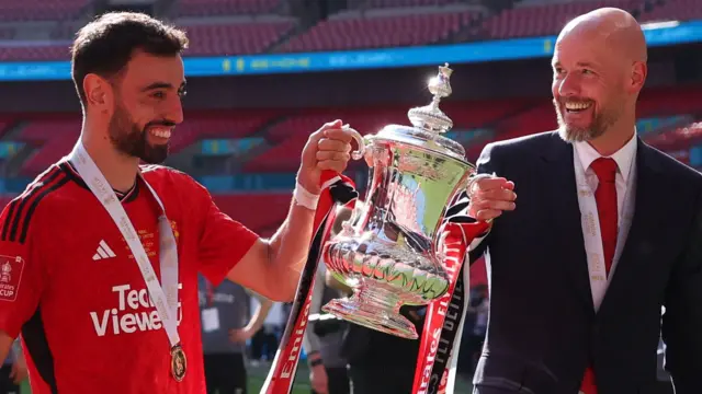 Bruno Fernandes and Erik ten Hag lift the FA Cup