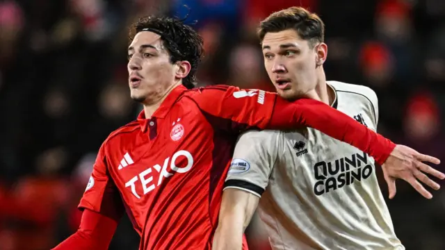 Aberdeen's Marko Lazetic and Dundee United's Iurie Iovu