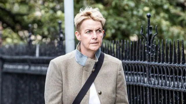 Former Hibs chief executive Leeann Dempster arrives at the service