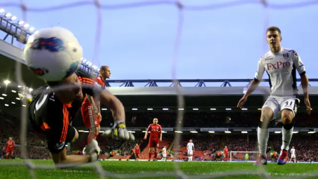 Liverpool's Martin Skrtel scores an own goal against Fulham