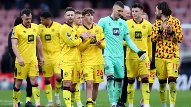 Sheffield United players console one another after conceding a late equaliser at Bournemouth in the Premier League