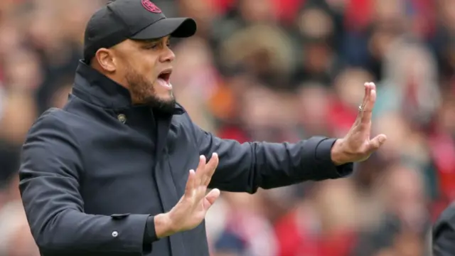 Vincent Kompany gestures on the touchline