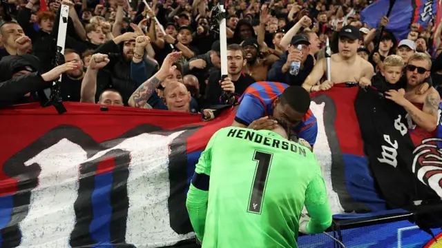 Dean Henderson celebrates with the Crystal Palace fans
