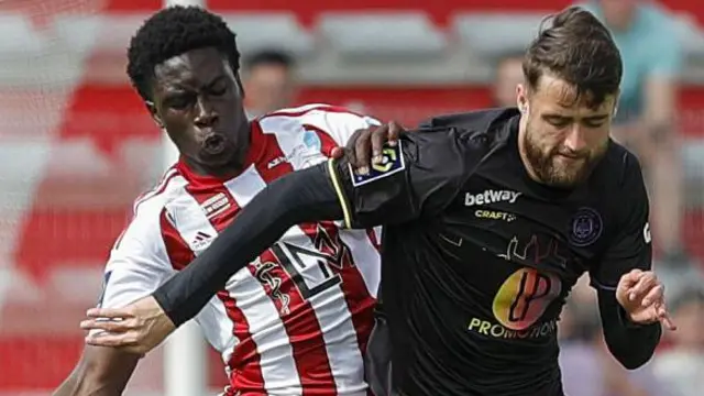 Toulouse's Dutch-Bosnian striker Said Hamulic (R) fights for the ball with Ajaccio's French forward Moussa Soumano (L) during the French L1 football match between AC Ajaccio and Toulouse FC at Stade Francois Coty in Ajaccio
