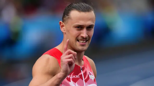 Elliot Jones celebrates his win in the men's 100m heats at the Commonwealth Games in Glasgow