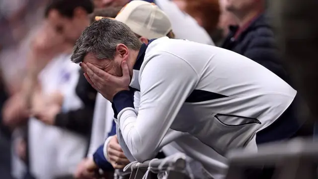 Tottenham Hotspur fan looks dejected 