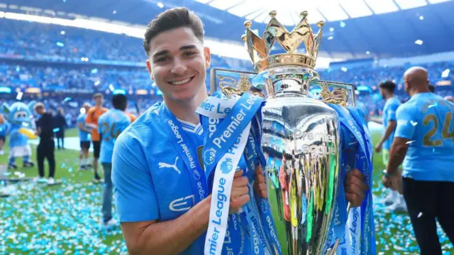 Julian Alvarez with the Premier League trophy