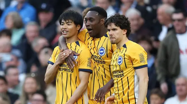 Brighton & Hove Albion's Kaoru Mitoma celebrates scoring his side's first goal with Danny Welbeck during the Premier League match between Tottenham Hotspur and Brighton & Hove Albion at Tottenham Hotspur Stadium 