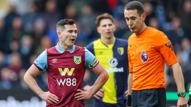 Burnley's Josh Cullen complains to referee David Coote after his goal was disallowed