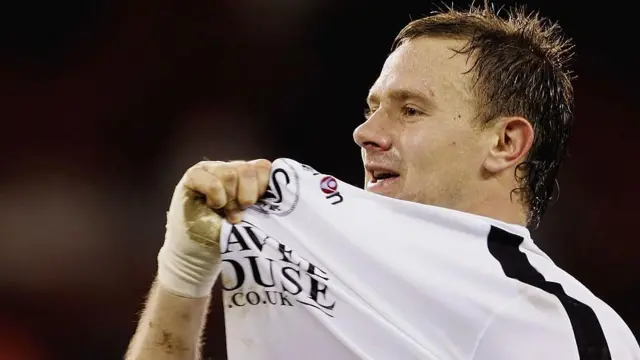 Kristian O'Leary celebrates during his time as a Swansea player