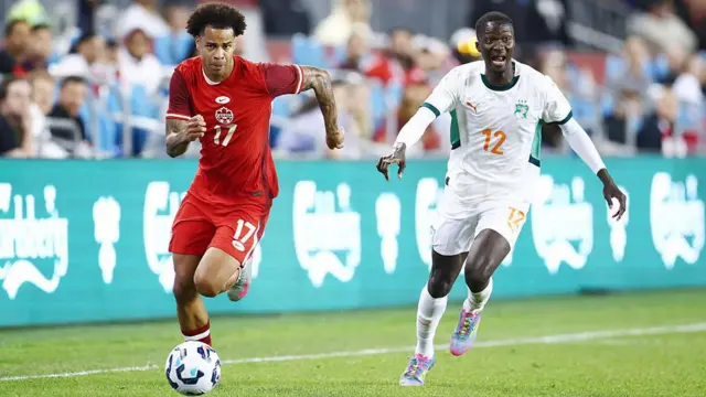  Tajon Buchanan of Canada and Ivory Coast's Mohamed Diomande