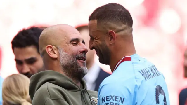 Pep Guardiola celebrates with Kyle Walker