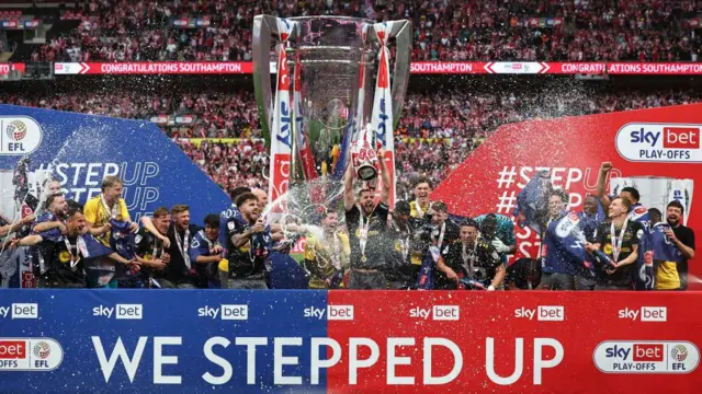 Jack Stephens of Southampton lifts the Sky Bet Championship Play-off Final Trophy