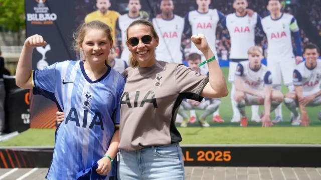 A mother and daughter pose for a picture at the Europa League final fan zone