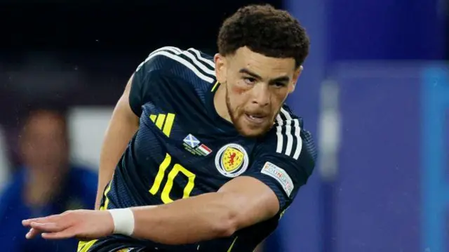 Che Adams in action for Scotland