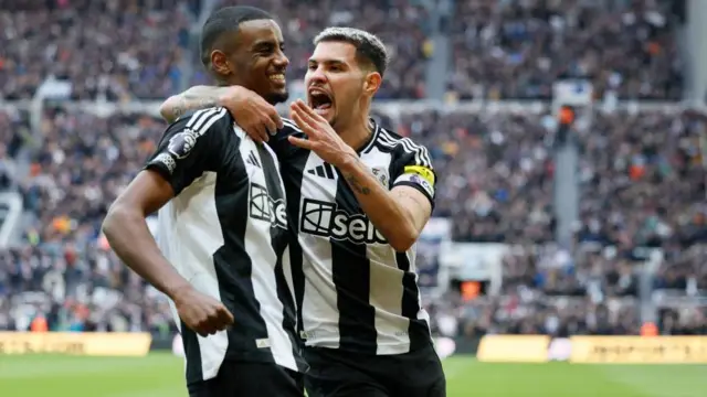 Bruno Guimaraes hugs Alexander Isak after a goal. 
