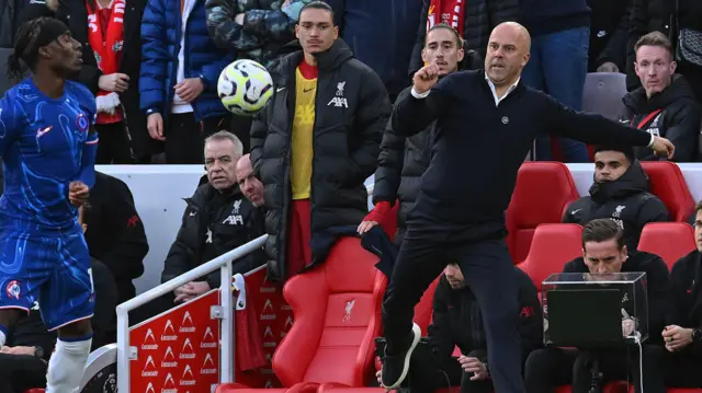 Arne Slot Head Coach of Liverpool kicks the ball during the Premier League match between Liverpool FC and Chelsea FC at Anfield