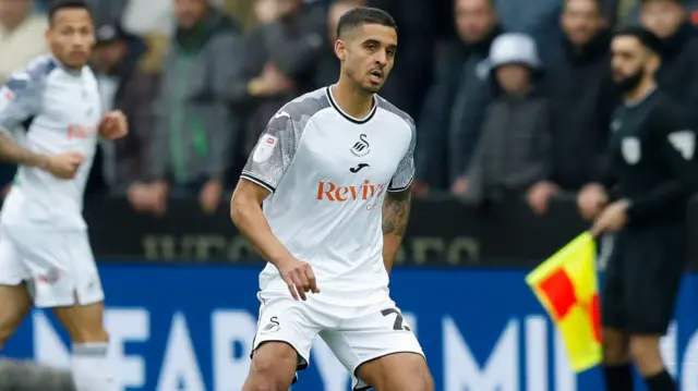 Kyle Naughton in action against Cardiff