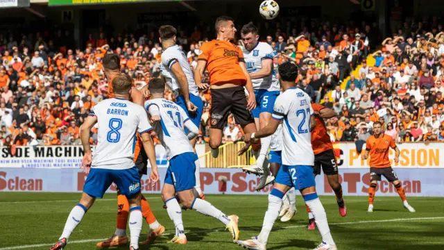 Dundee United centre-half Ross Graham heads wide