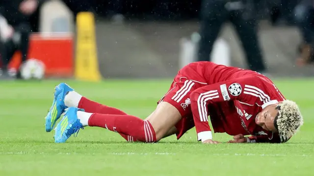 Hugo Ekitike of Liverpool is injured against PSG