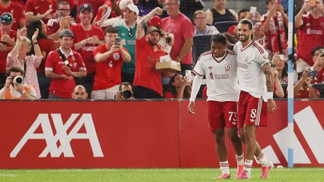 Rio Ngumoha of Liverpool celebrates after scoring the team's first goal in the second half with teammate Dominik Szoboszlai