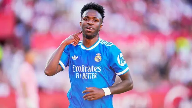 Real Madrid left winger Vinicius Jr celebrates scoring against Sevilla