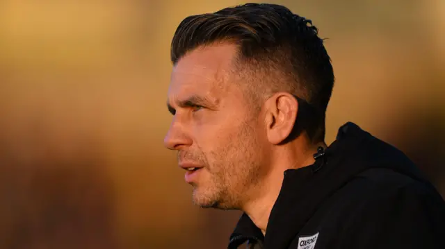 A close up of Matt Bloomfield wearing a black Oxford United jacket in April