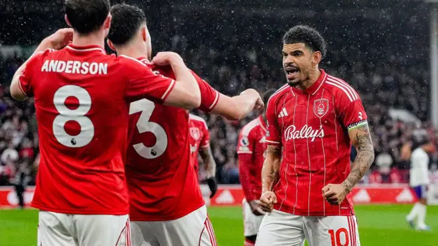 Morgan Gibbs-White celebrating with his team-mates