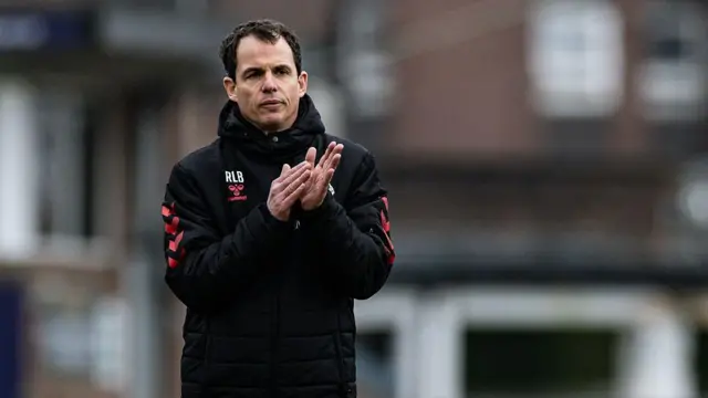Regis Le Bris applauds his side's travelling supporters