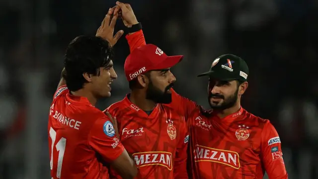 Naseem Shah (left) celebrates a wicket with his Islamabad United team-mates during the Pakistan Super League 