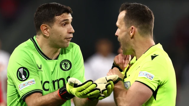 Emiliano Martinez speaks to the referee during Aston Villa's game with Lille