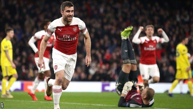 Sokratis celebrates scoring