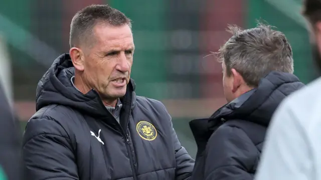 Stephen Baxter shakes Declan Devine's hand