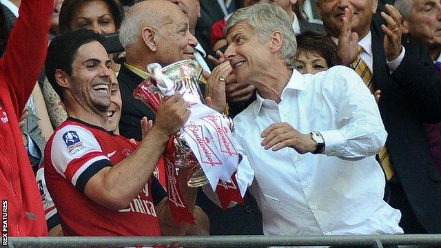 Mikel Arteta celebrates with boss Arsene Wenger following Arsenal's victory over Hull City in the 2014 FA Cup final