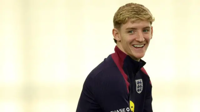 Anthony Gordon smiles during England training