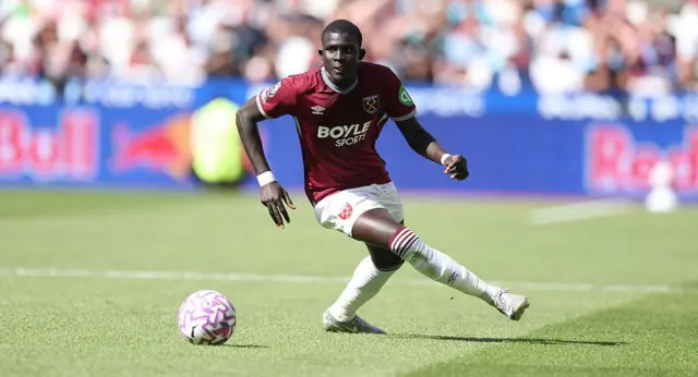 El Hadji Malick Diouf has the ball at his feet in a fixture on a sunny day