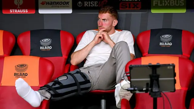 Dejan Kulusevski of Tottenham Hotspur sits in the dugout prior to the UEFA Europa League Final 2025 b