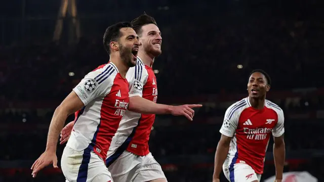 Mikel Merino celebrates his goal with Declan Rice