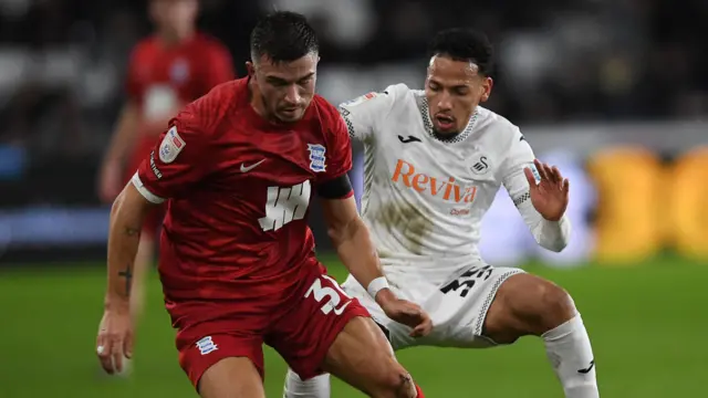 Ronald of Swansea City is challenged by Kai Wagner of Birmingham in the two clubs' most recent meeting 