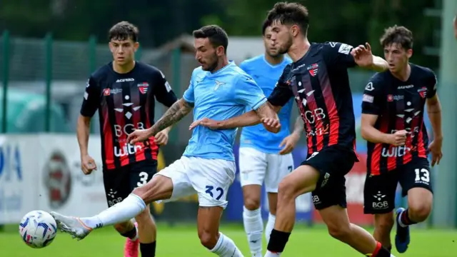 Danilo Cataldi of Lazio competes for the ball with Zan Besir of Primorje 