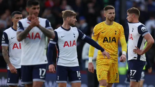 Tottenham players stand dejected after losing to Crystal Palace