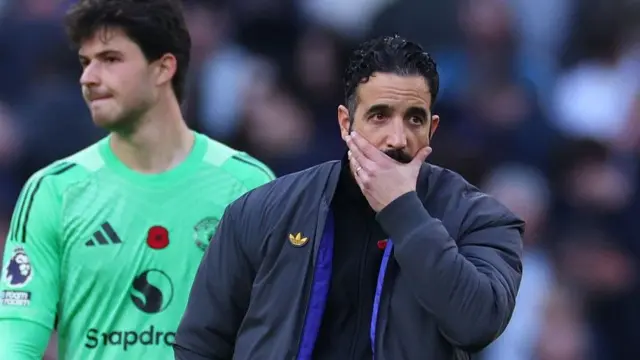 Manchester United head coach Ruben Amorim looks concerned in his technical area