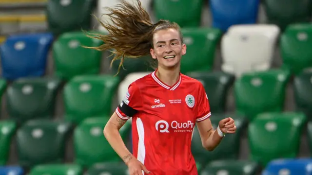 Caitlin McGuinness celebrates scoring