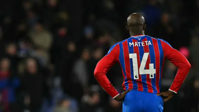 Image of back of Jean-Philippe Mateta as he stands with hands on hips