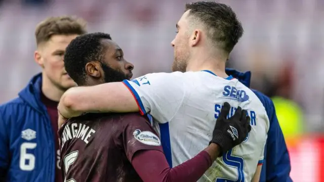 Hearts' Beni Baningime and Rangers' John Souttar embrace