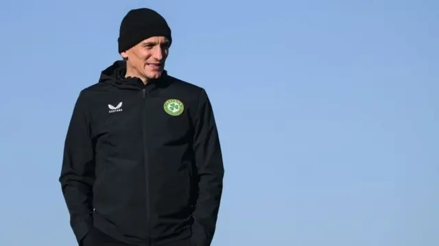 A picture of new Brentford manager Keith Andrews wearing a beanie hat and Republic of Ireland jacket