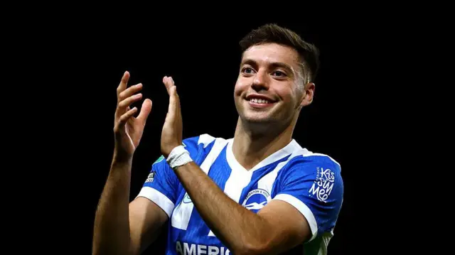 Stefanos Tzimas of Brighton & Hove Albion celebrates victory following the Carabao Cup Second Round match between Oxford United and Brighton & Hove Albion at Kassam Stadium